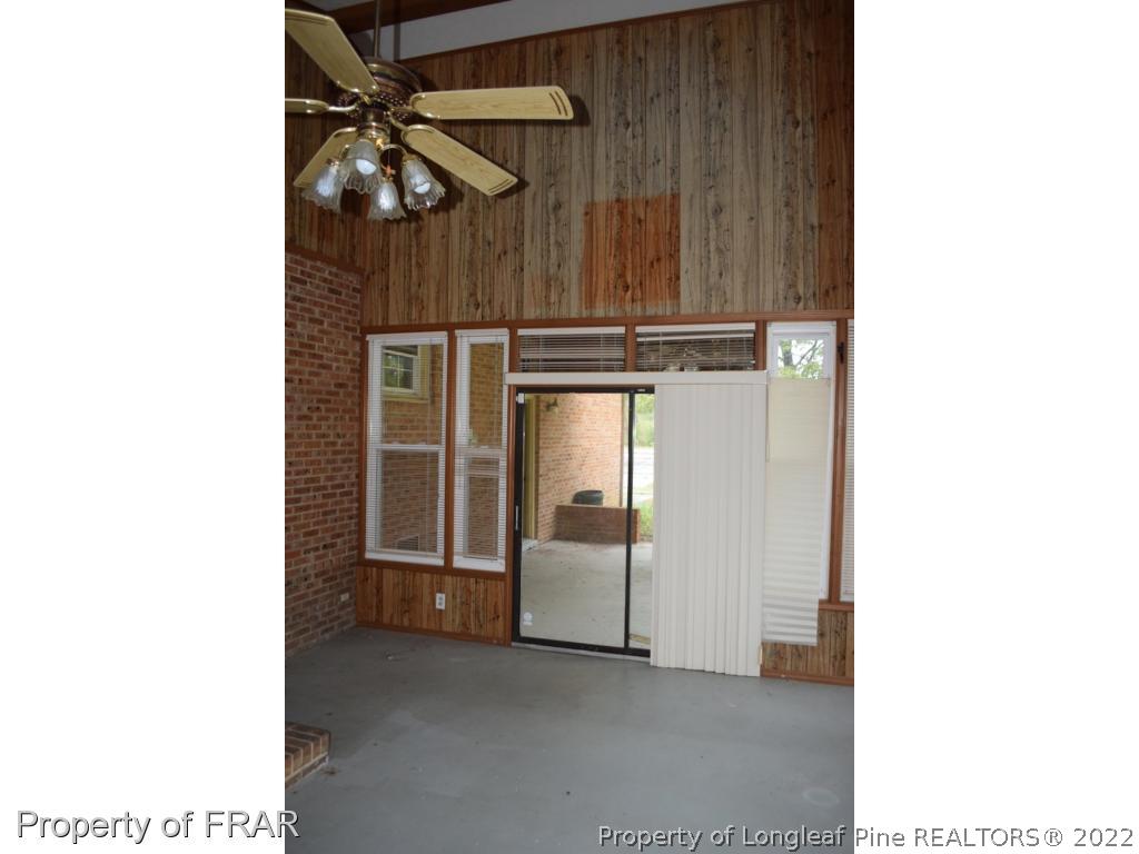 26861 Harold Morris Road Wagram, NC 28396 - Photo 17 of 24 a view of a room with rack and white walls