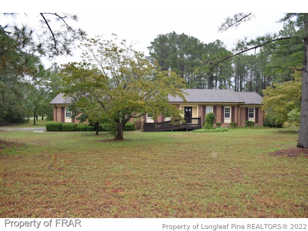 26861 Harold Morris Road Wagram, NC 28396 - Photo 21 of 24 a front view of a house with a yard