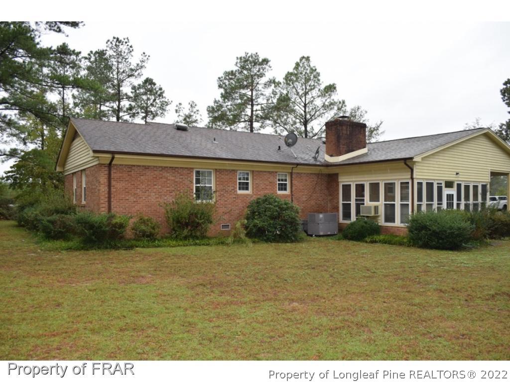 26861 Harold Morris Road Wagram, NC 28396 - Photo 24 of 24 a front view of a house with garden