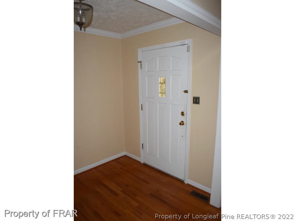 26861 Harold Morris Road Wagram, NC 28396 - Photo 3 of 24 a view of a room with wooden floor