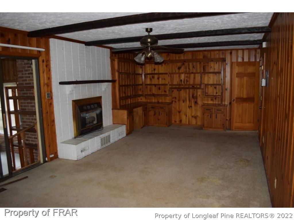 26861 Harold Morris Road Wagram, NC 28396 - Photo 9 of 24 a view of empty room with a fireplace