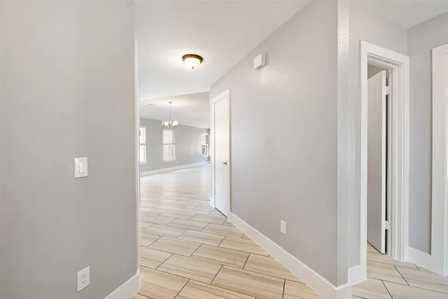 a view of an empty room with a window