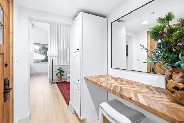 a view of a swimming pool with an outdoor seating and a yard