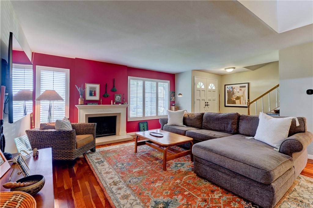 a living room with furniture or couch and a fireplace