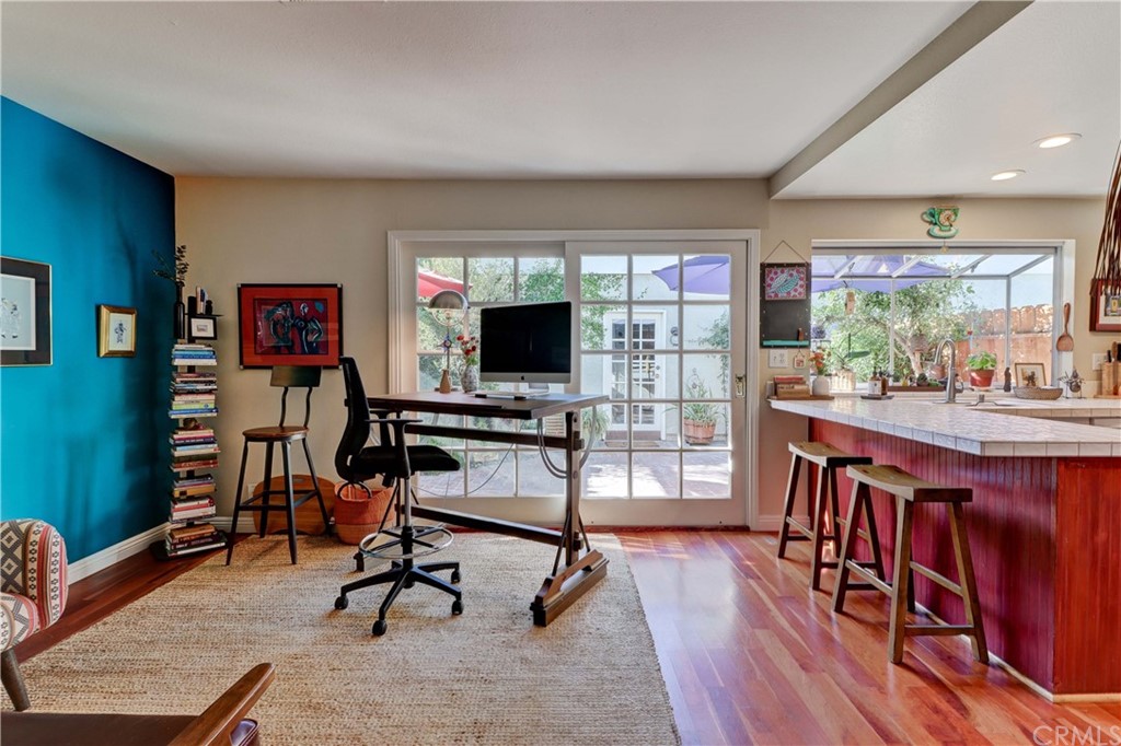 3 Sunflower, Unit 27 Irvine, CA 92604 - Photo 11 of 47 a view of a livingroom with furniture and a flat screen tv