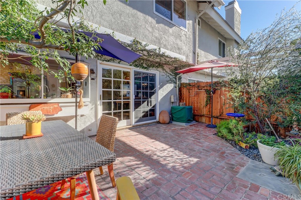3 Sunflower, Unit 27 Irvine, CA 92604 - Photo 15 of 47 a view of a house with backyard and sitting area
