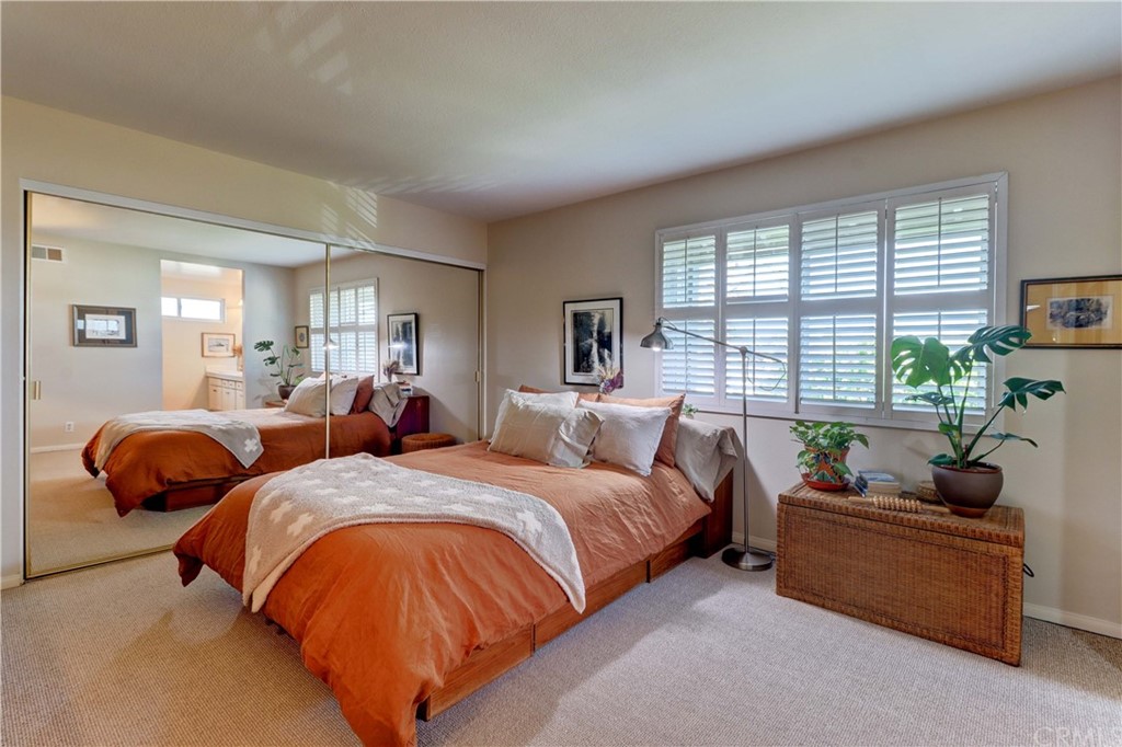 3 Sunflower, Unit 27 Irvine, CA 92604 - Photo 17 of 47 a bedroom with bed and window