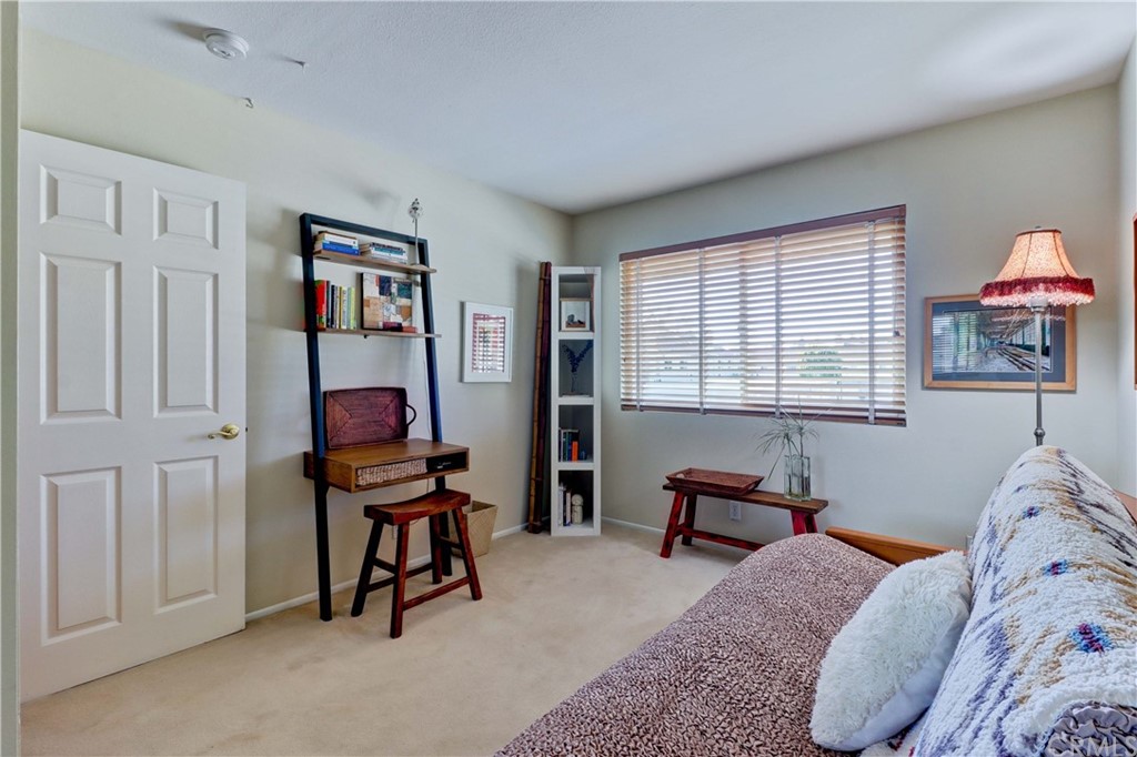 3 Sunflower, Unit 27 Irvine, CA 92604 - Photo 26 of 47 a bedroom with bed and a window