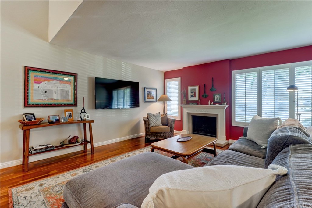 3 Sunflower, Unit 27 Irvine, CA 92604 - Photo 3 of 47 a living room with furniture and a fireplace