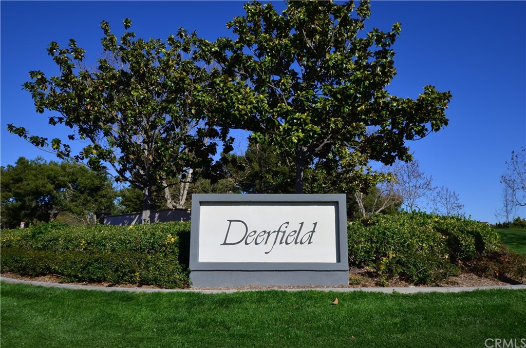 3 Sunflower, Unit 27 Irvine, CA 92604 - Photo 33 of 47 a sign that is sitting in front of a tree