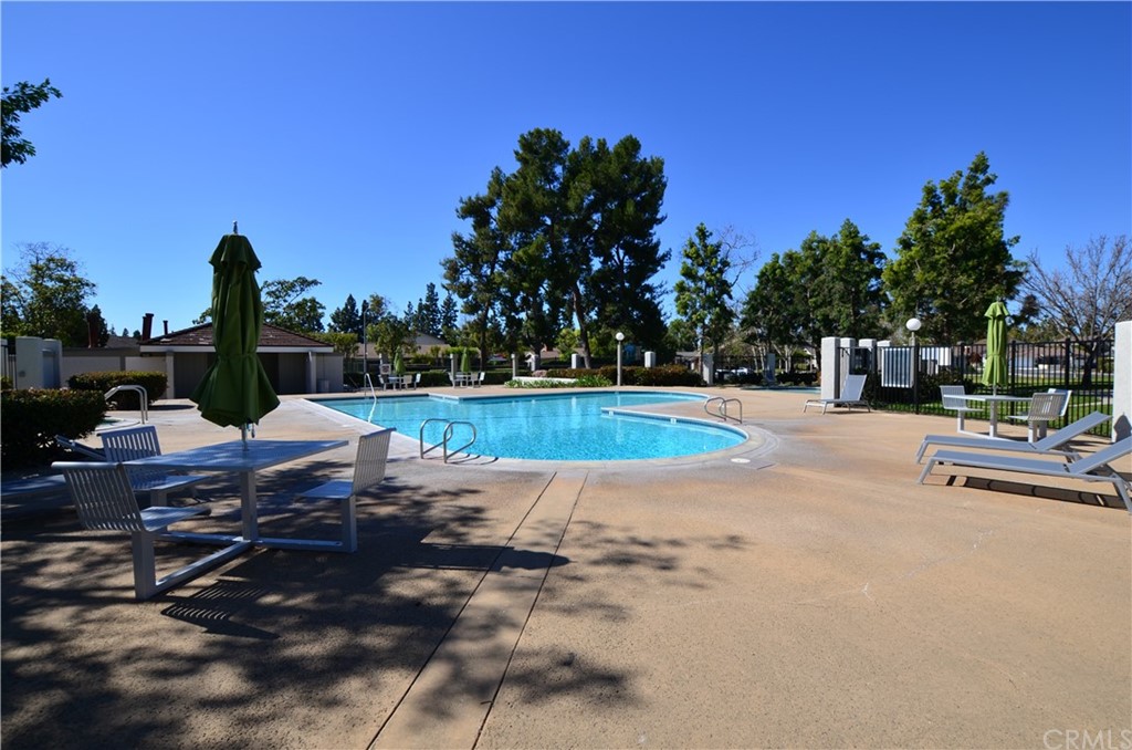 3 Sunflower, Unit 27 Irvine, CA 92604 - Photo 34 of 47 a view of a swimming pool with a patio