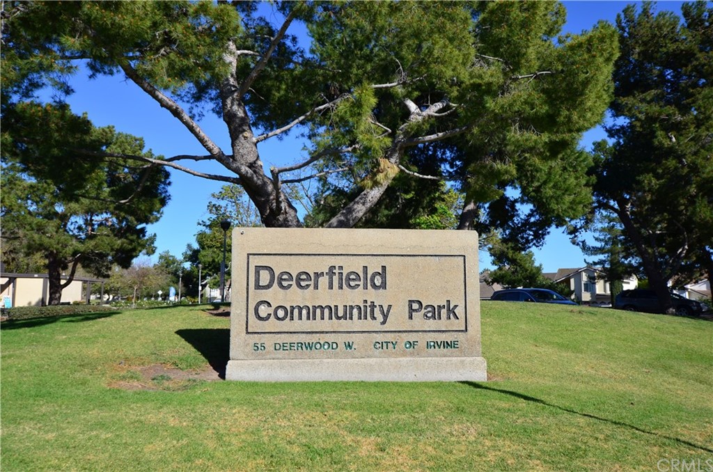 3 Sunflower, Unit 27 Irvine, CA 92604 - Photo 40 of 47 a sign of golf club on a wall under a tree