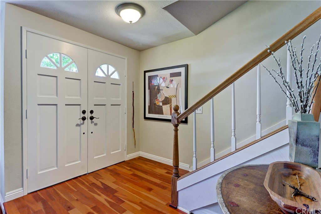 3 Sunflower, Unit 27 Irvine, CA 92604 - Photo 4 of 47 a view of an entryway with wooden floor