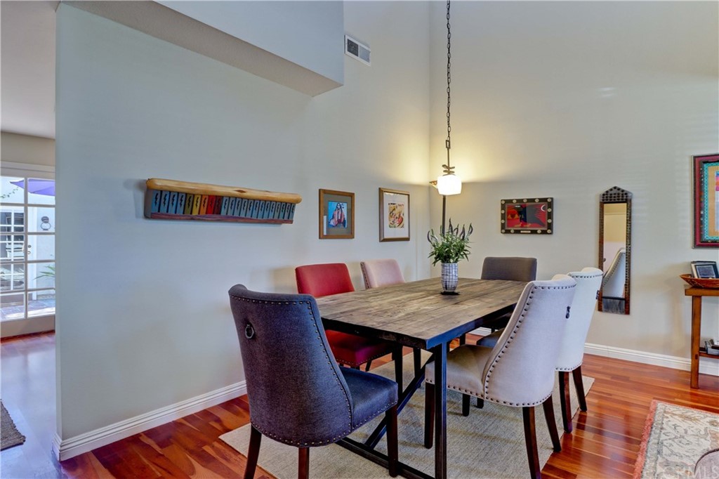 3 Sunflower, Unit 27 Irvine, CA 92604 - Photo 5 of 47 a view of a dining room with furniture and wooden floor