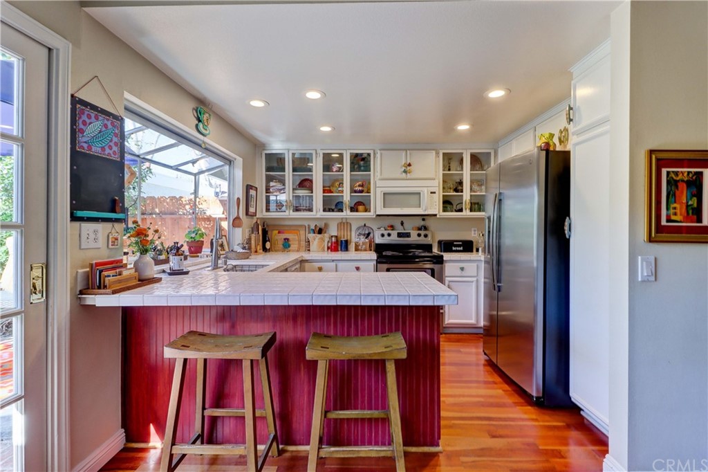 3 Sunflower, Unit 27 Irvine, CA 92604 - Photo 8 of 47 a kitchen with stainless steel appliances granite countertop a refrigerator and a stove top oven