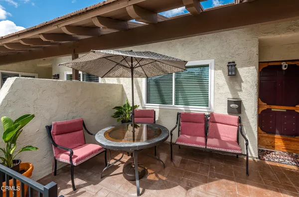 a outdoor space with the couches and a potted plant