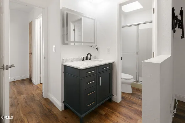 a bathroom with a toilet and shower