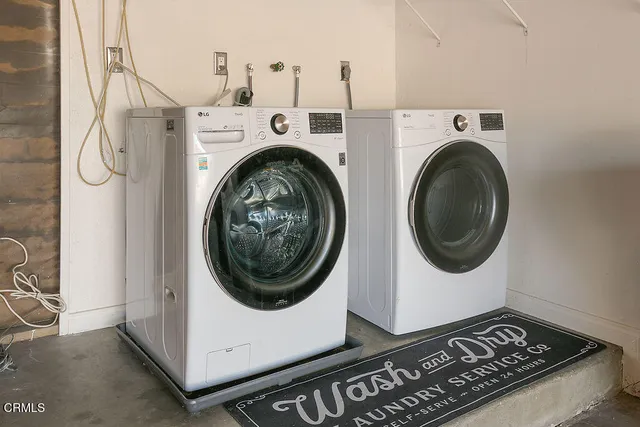 a view of swimming pool with a garden and plants