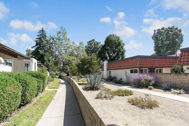 a view of a pathway of a house with wooden floor