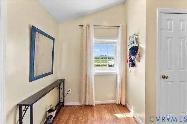 a view of front door with wooden floor