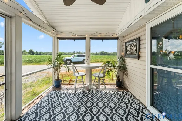 a view of a patio with a table chairs and balcony