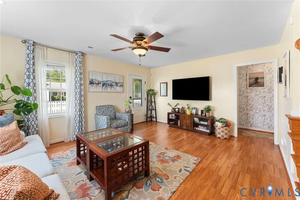 a living room with furniture and a flat screen tv