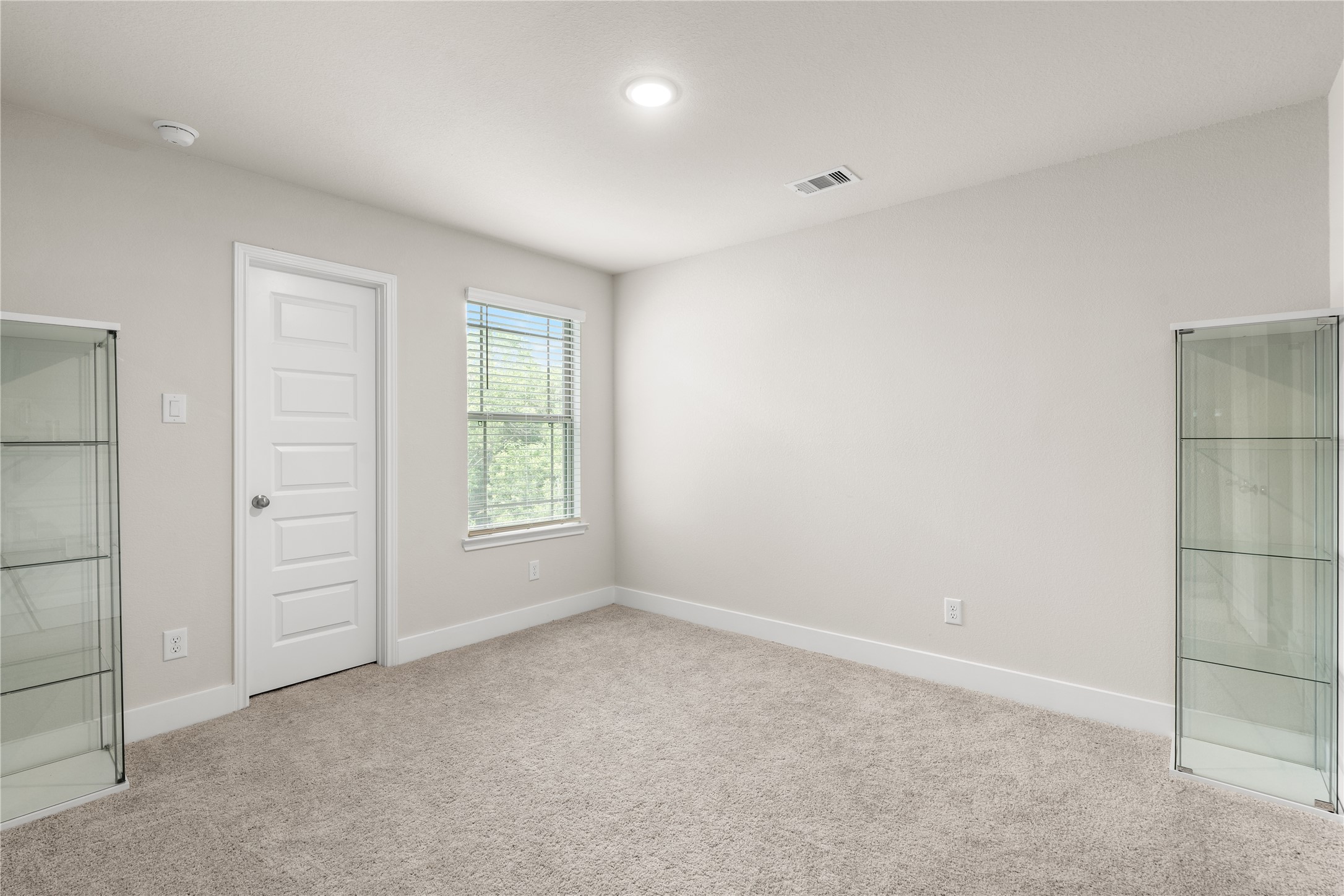4001 Baja Lane Houston, TX 77045 - Photo 23 of 27 Comfortably proportioned with a large window and walk-in closet, this secondary bedroom is designed to adapt to changing needs over time.