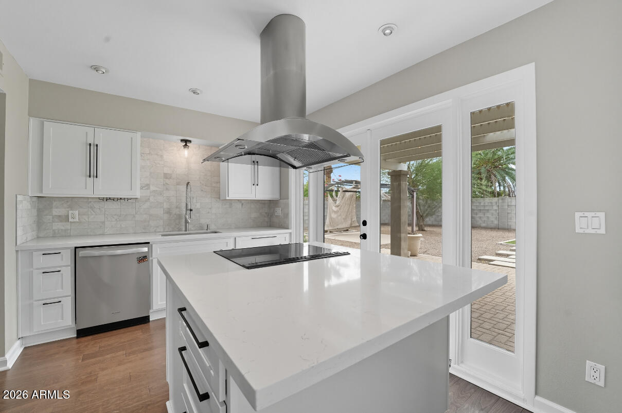 8437 East Thomas Road Scottsdale, AZ 85251 - Photo 13 of 55 a kitchen with stainless steel appliances granite countertop a sink a stove and a refrigerator