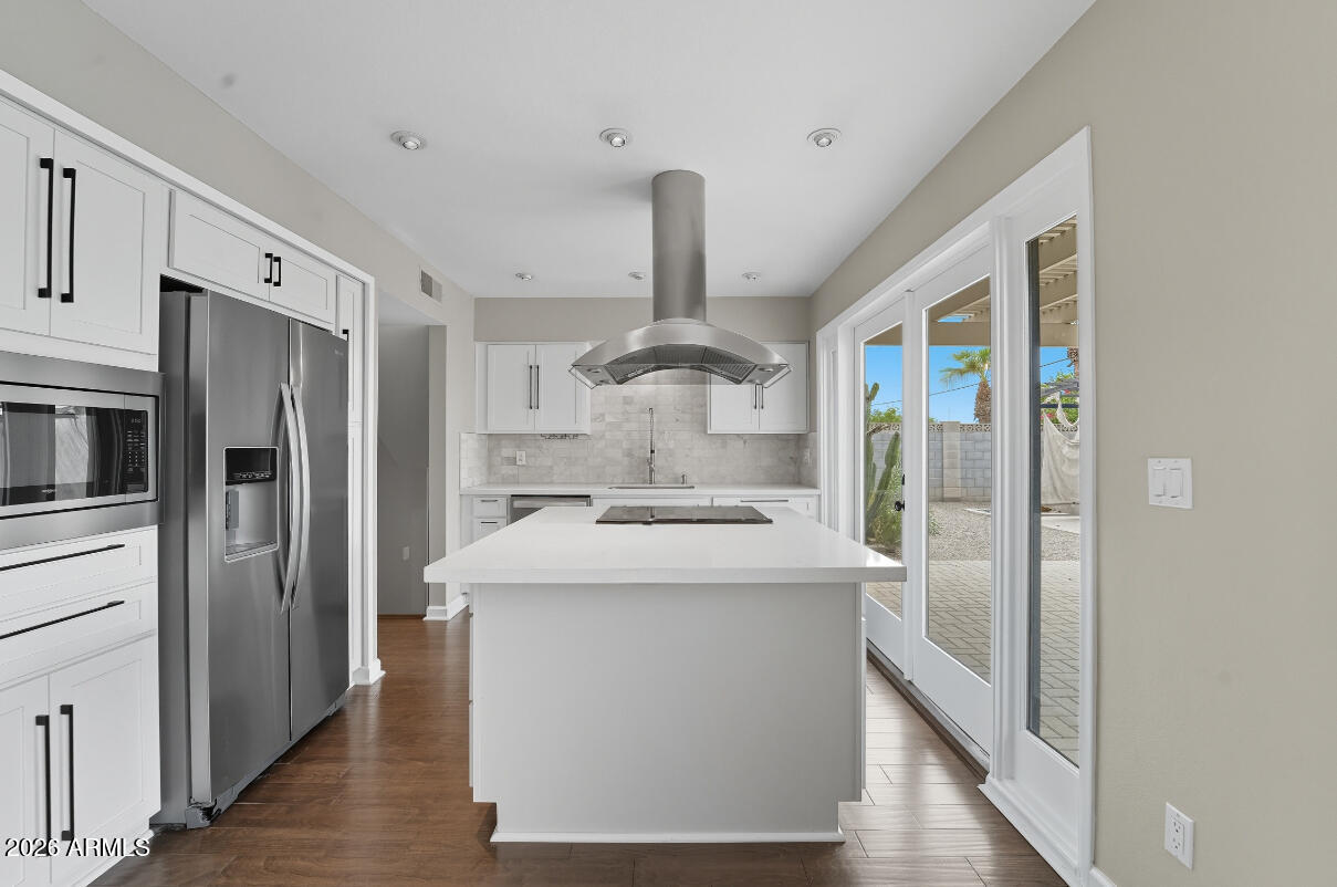 8437 East Thomas Road Scottsdale, AZ 85251 - Photo 15 of 55 a kitchen with stainless steel appliances a sink stove and refrigerator