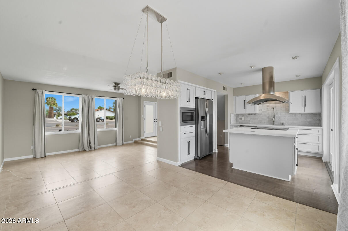 8437 East Thomas Road Scottsdale, AZ 85251 - Photo 20 of 55 a view of a kitchen with refrigerator and cabinets