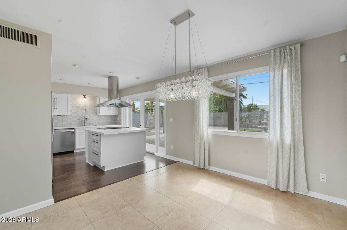 8437 East Thomas Road Scottsdale, AZ 85251 - Photo 22 of 55 a view of a kitchen with kitchen island a sink stainless steel appliances and cabinets