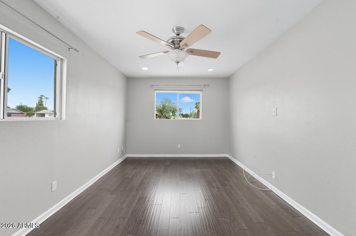 8437 East Thomas Road Scottsdale, AZ 85251 - Photo 24 of 55 wooden floor in an empty room with a window
