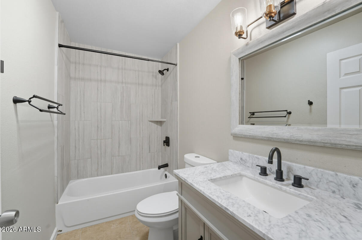 8437 East Thomas Road Scottsdale, AZ 85251 - Photo 27 of 55 a bathroom with a granite countertop sink toilet and shower