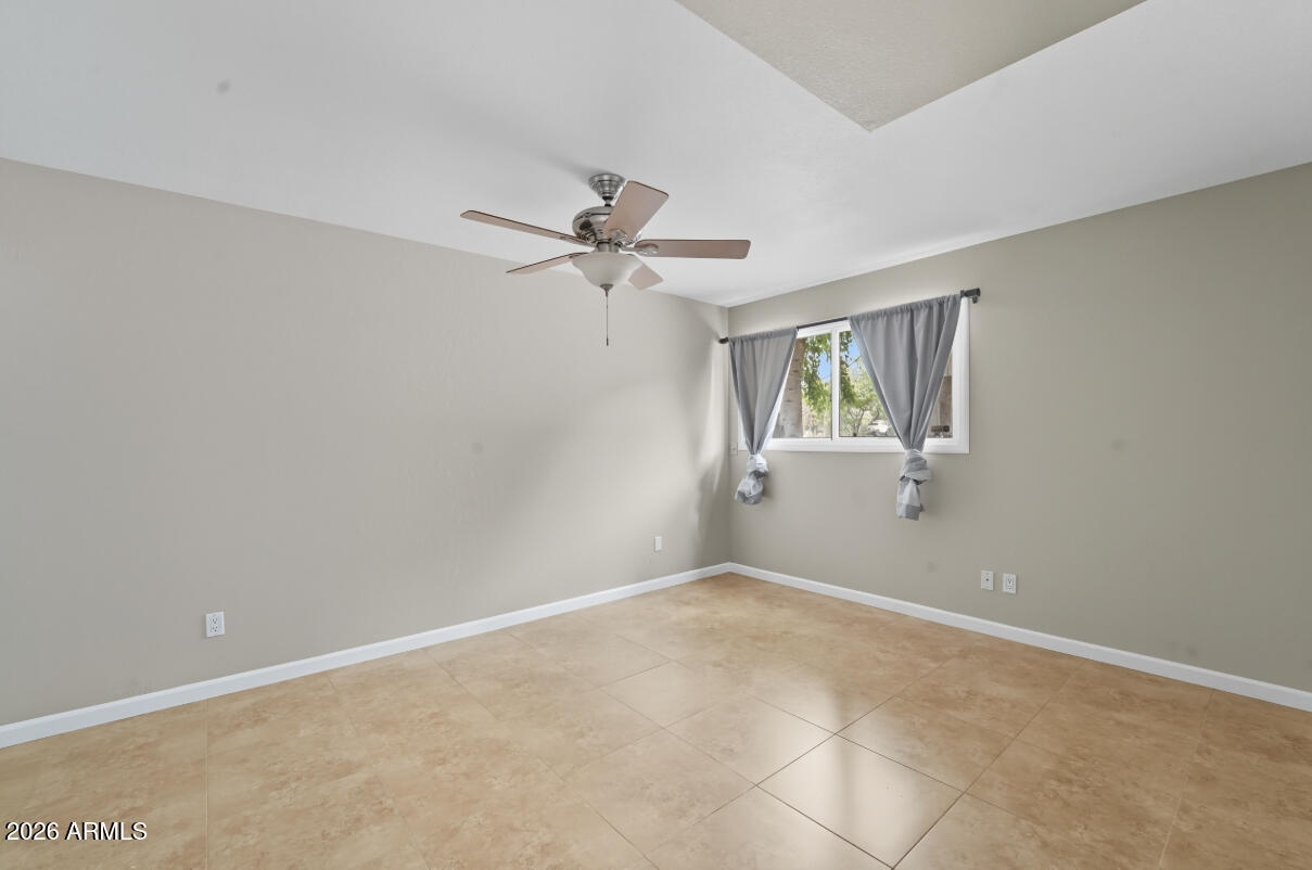 8437 East Thomas Road Scottsdale, AZ 85251 - Photo 28 of 55 a view of a room with a ceiling fan and a window