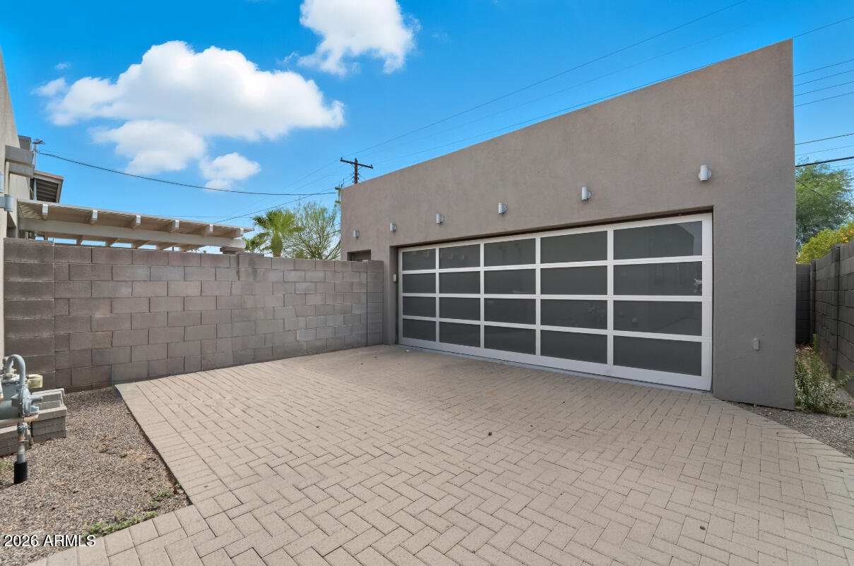 8437 East Thomas Road Scottsdale, AZ 85251 - Photo 49 of 55 a view of a blue house with a yard
