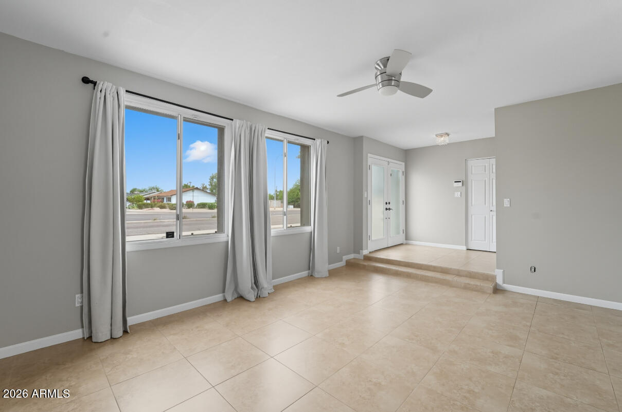 8437 East Thomas Road Scottsdale, AZ 85251 - Photo 8 of 55 a view of a livingroom with a chandelier fan and windows