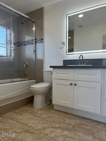 a bathroom with a toilet a sink and bathtub