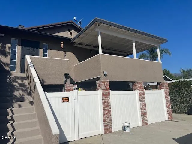 a view of house with yard