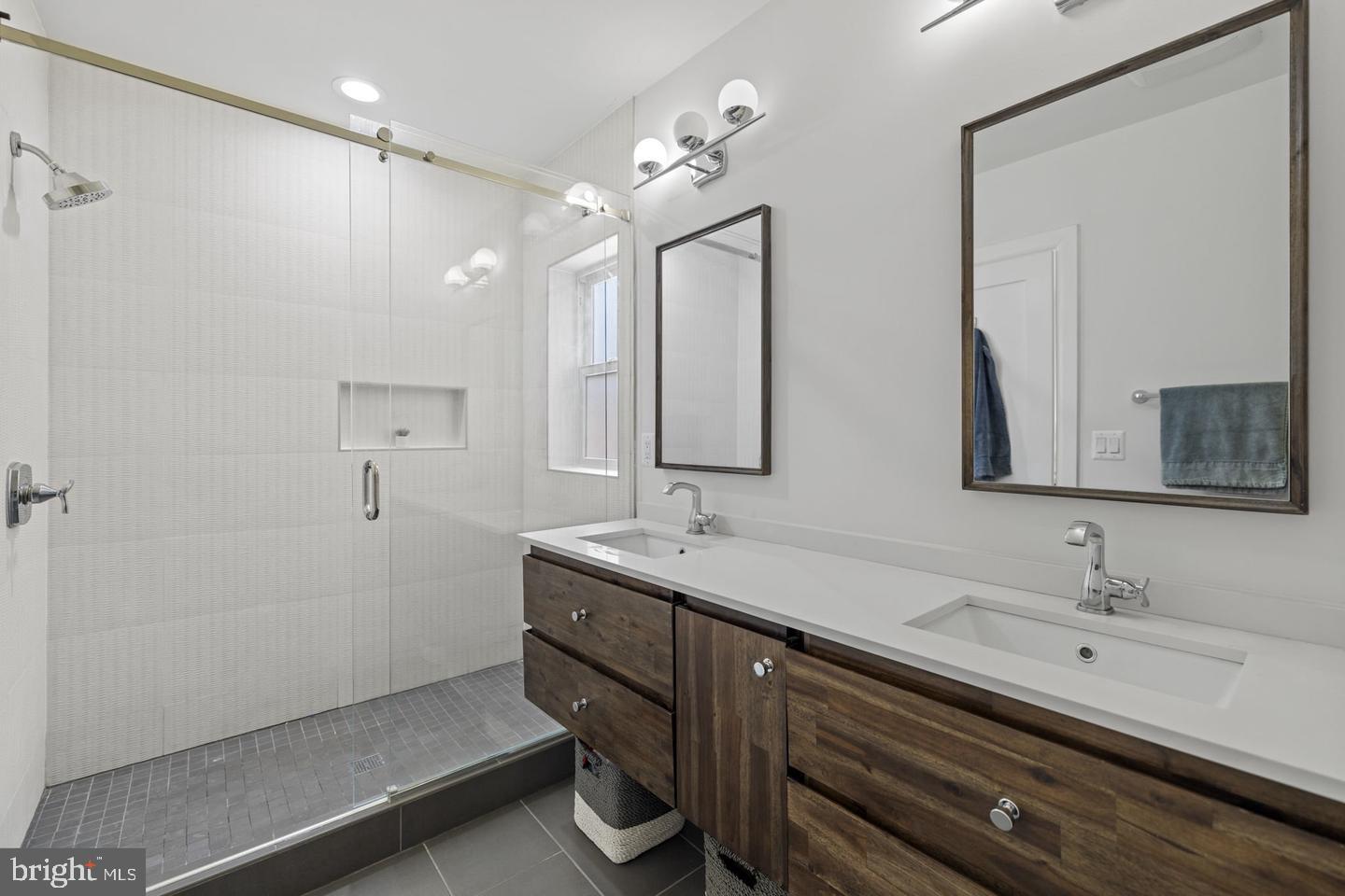 5908 17th Street Northwest Washington, DC 20011 - Photo 12 of 30 a bathroom with a double vanity sink mirror and double
