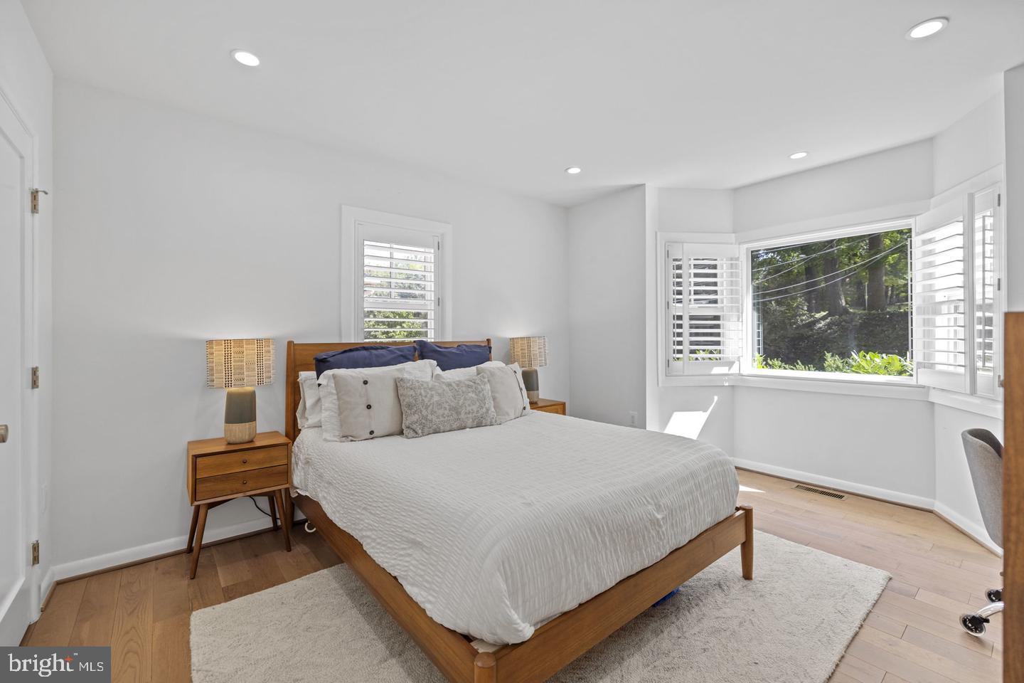 5908 17th Street Northwest Washington, DC 20011 - Photo 14 of 30 a bedroom with a bed and windows