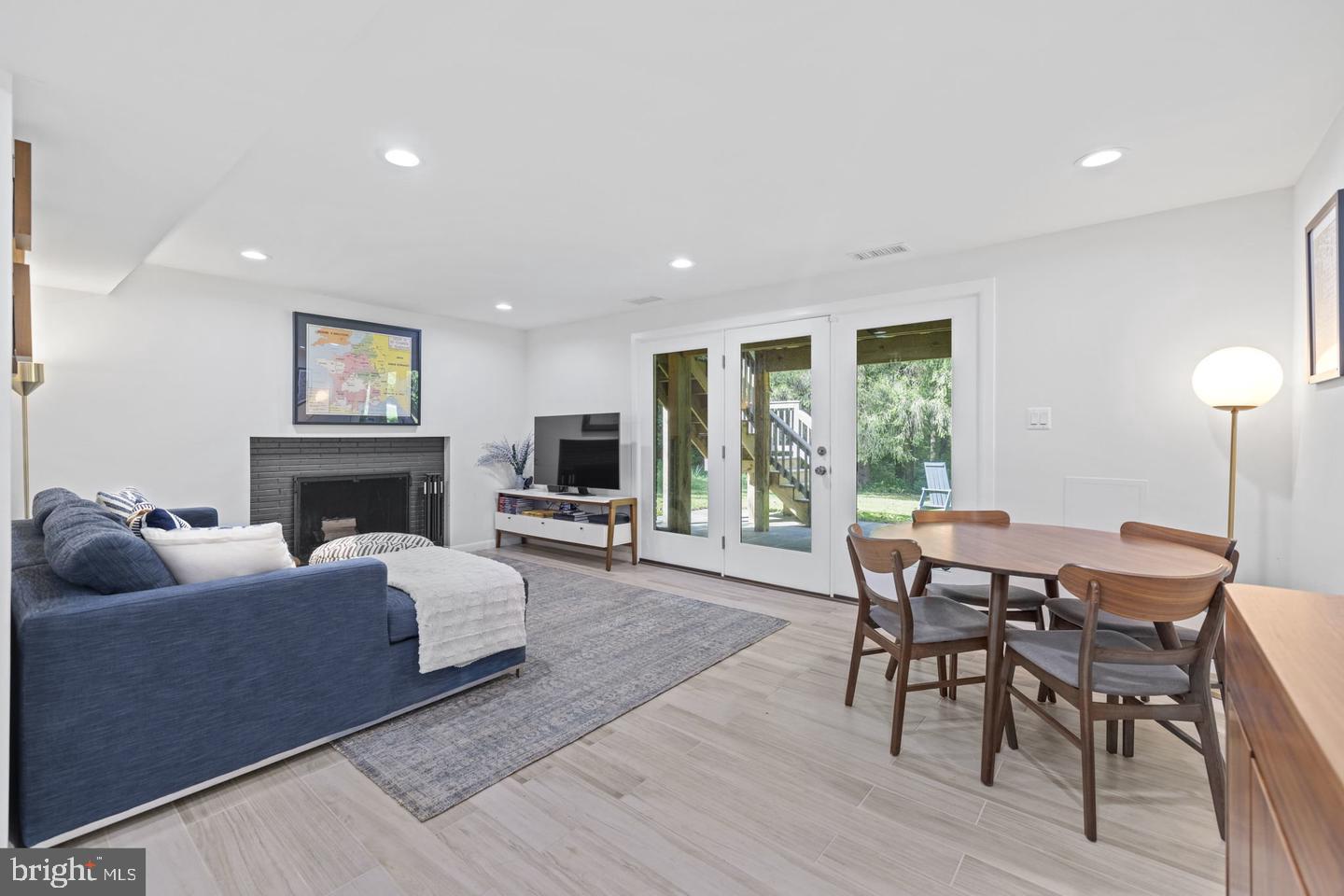 5908 17th Street Northwest Washington, DC 20011 - Photo 19 of 30 a living room with furniture a fireplace and a large window