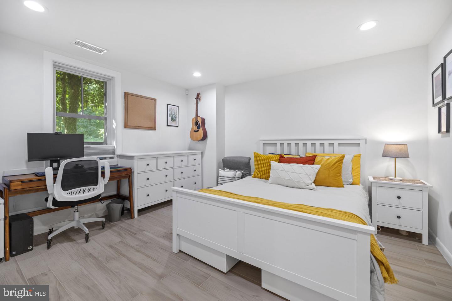 5908 17th Street Northwest Washington, DC 20011 - Photo 21 of 30 a bed room with a bed and a chair