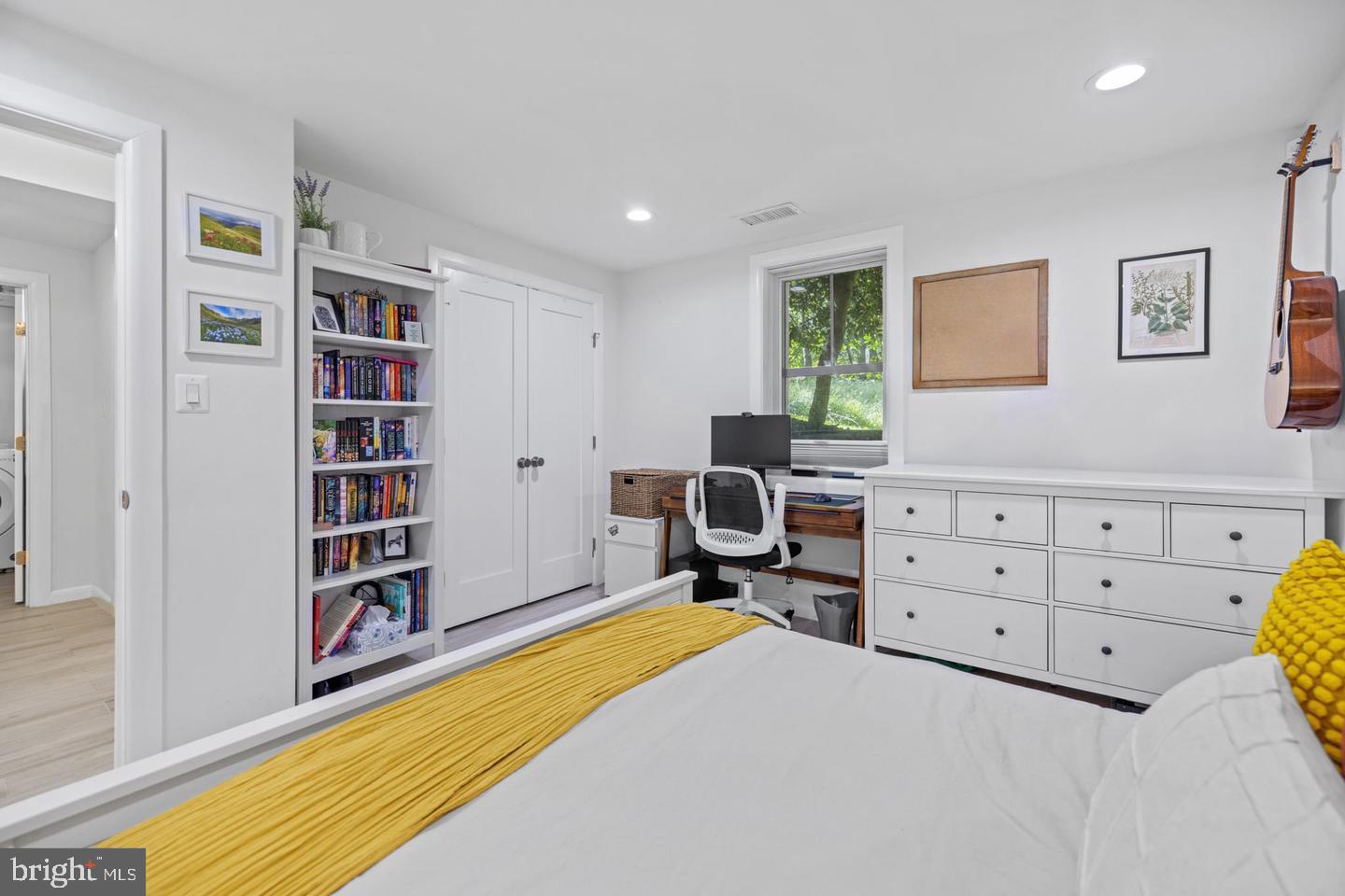 5908 17th Street Northwest Washington, DC 20011 - Photo 22 of 30 a bed room with a bed and a book shelf