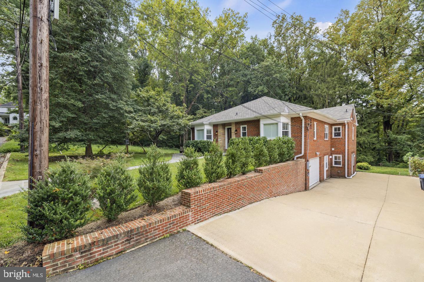 5908 17th Street Northwest Washington, DC 20011 - Photo 27 of 30 a front view of a house with a yard and green space