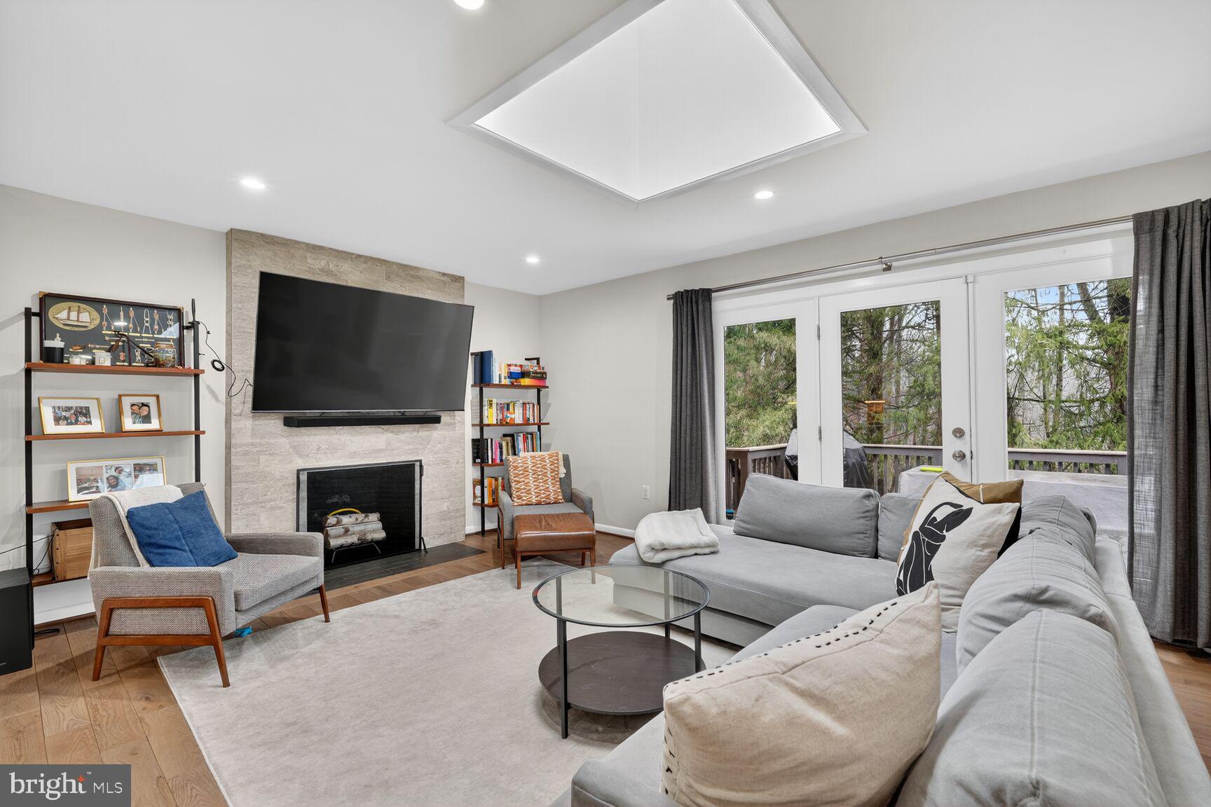 5908 17th Street Northwest Washington, DC 20011 - Photo 8 of 30 a living room with furniture flat screen tv and a fireplace
