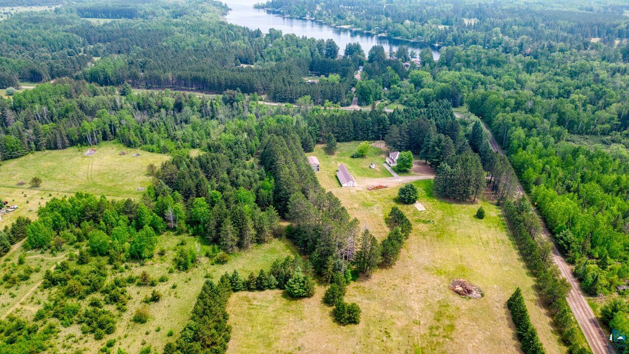 4755 Judd Road Gilbert, MN 55741 - Photo 49 of 50 Aerial view of a large body of water and a forest