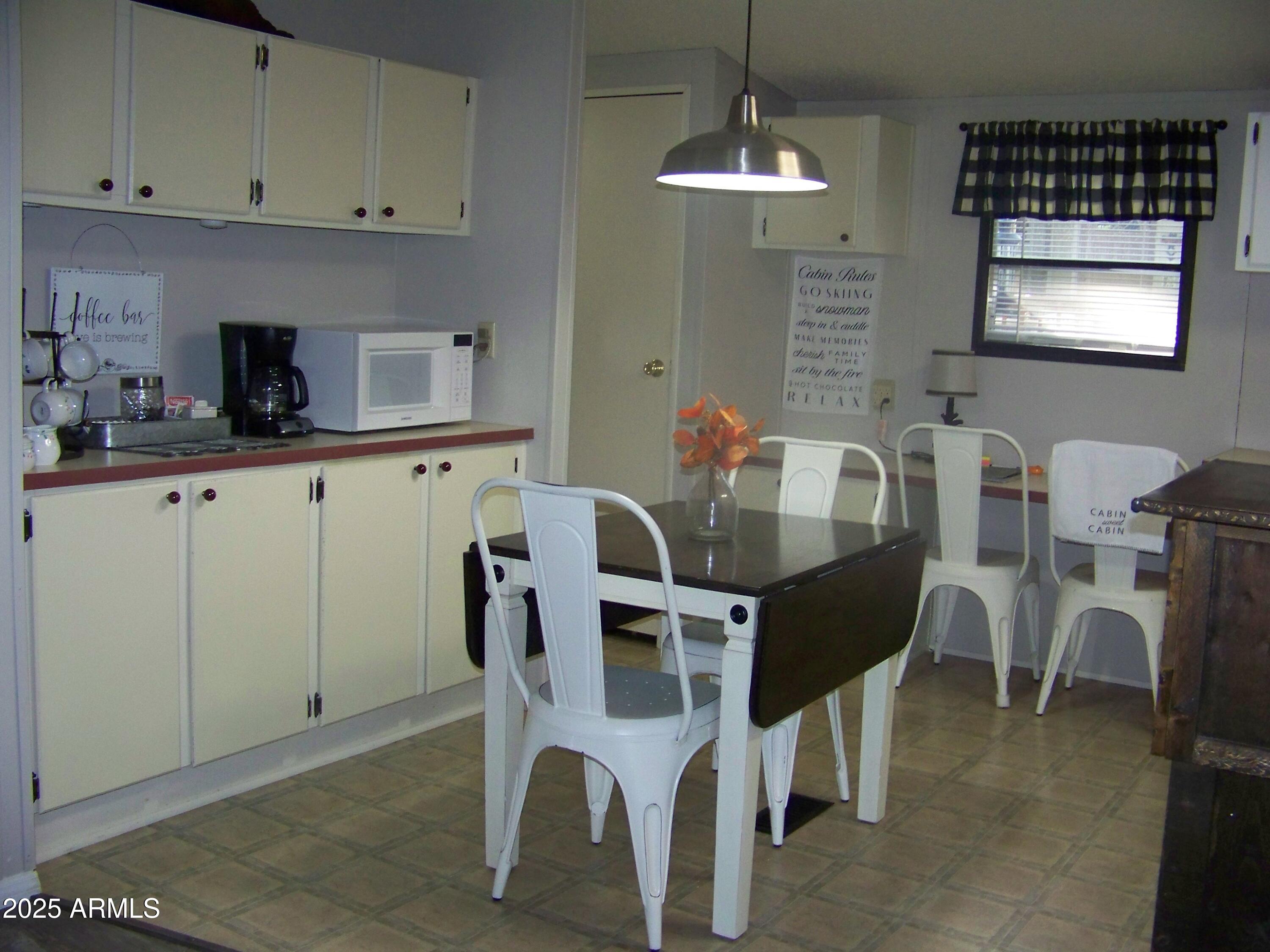 1167 White Tail Lane Pinetop, AZ 85935 - Photo 11 of 58 a dining room with furniture and window