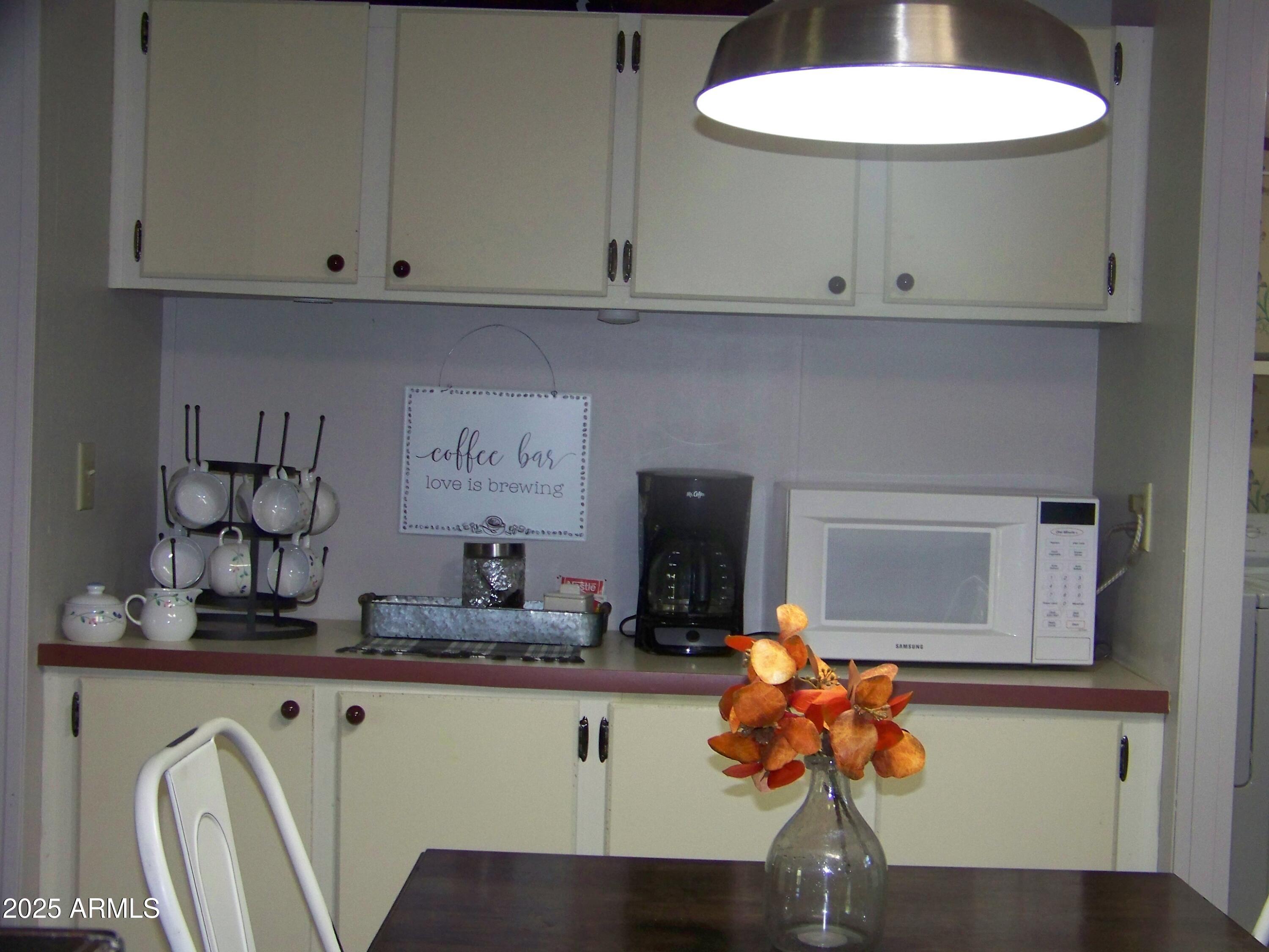 1167 White Tail Lane Pinetop, AZ 85935 - Photo 12 of 58 a kitchen with a sink cabinets and wooden floor