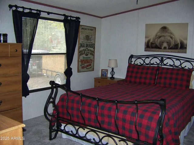 a view of front door with furniture and a window