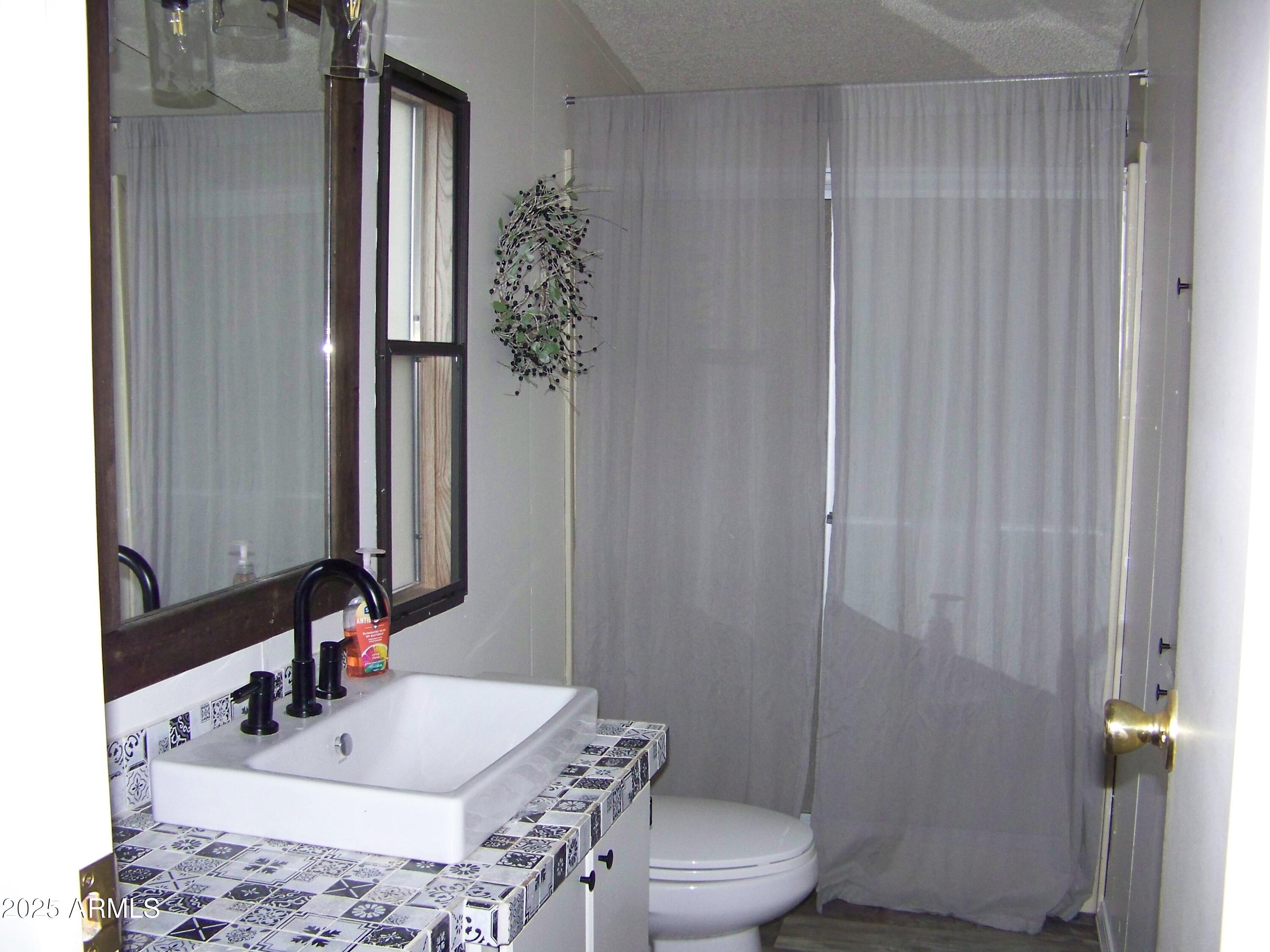 1167 White Tail Lane Pinetop, AZ 85935 - Photo 22 of 58 a bathroom with a sink toilet and shower
